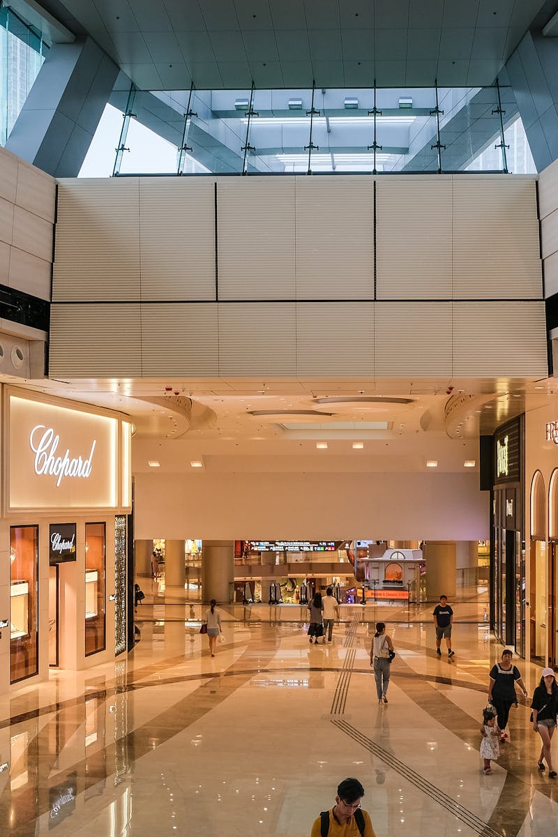 Explore the modern architecture of a luxury shopping mall in Hong Kong.